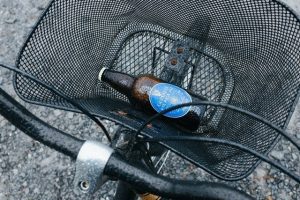 Beer bottle in a bike basket