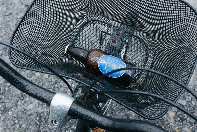 Beer bottle in a bike basket